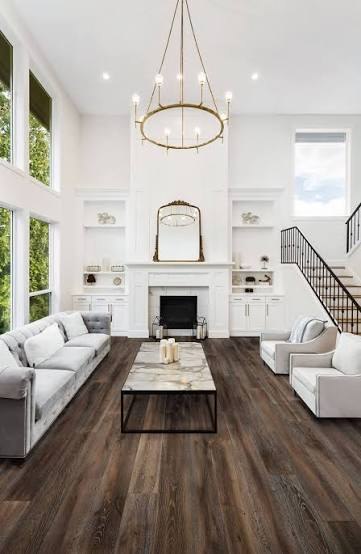 Bright living room with wide-plank wood flooring, used as design inspiration